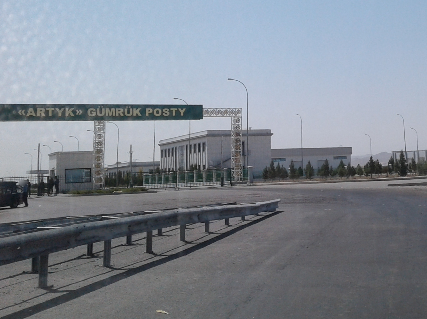 ARTYK GUMRUK POSTY | Messages From Heroes The "ARTYK GUMRUK POSTY" border crossing in Kyrgyzstan shows a modern building and security barriers, highlighting the.