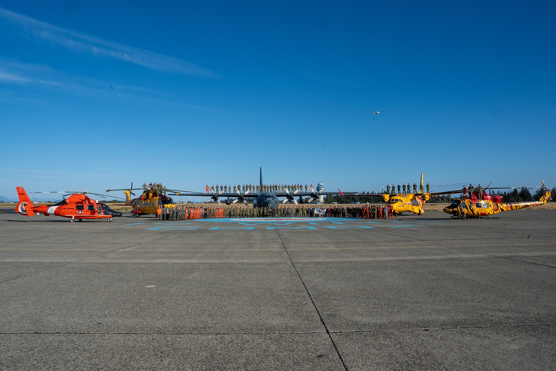 Coast Guard Aircraft | Messages From Heroes Coast Guard and Air Force aircraft are lined up on a runway, showcasing dedication to service.